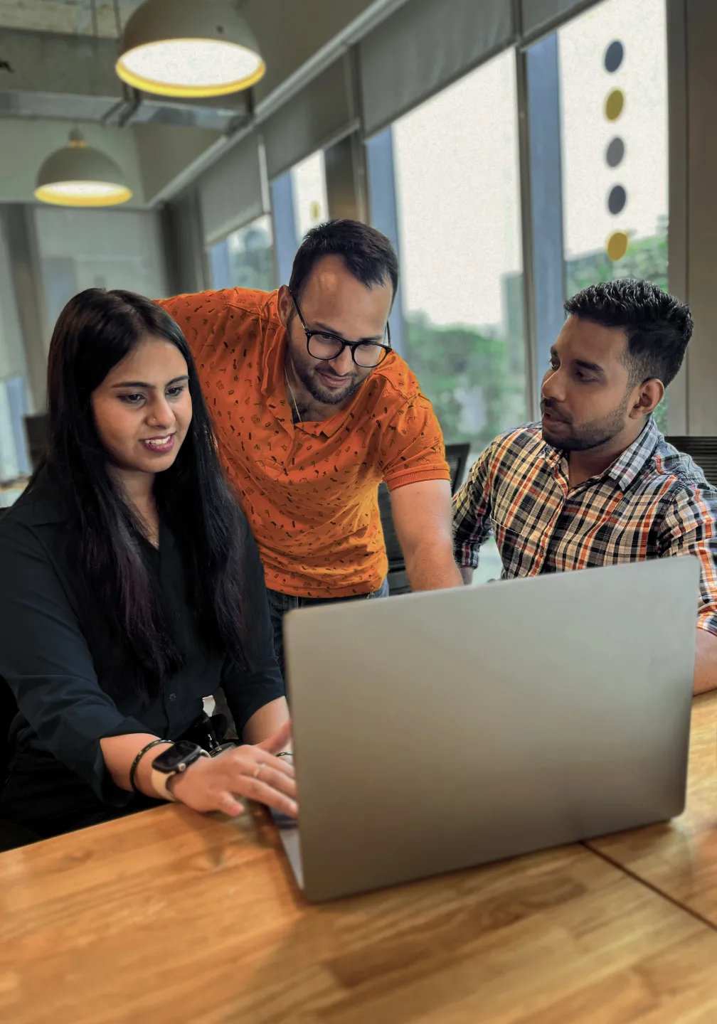 Team members have a happy discussion during an office meeting