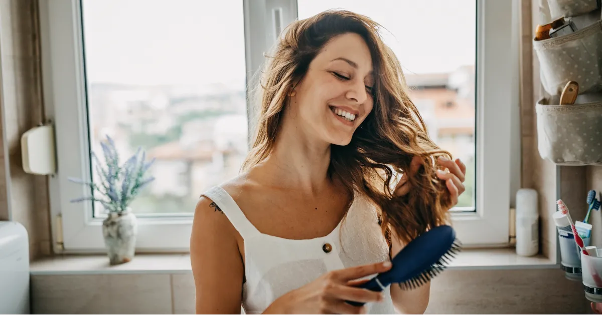 Woman blow drying hair