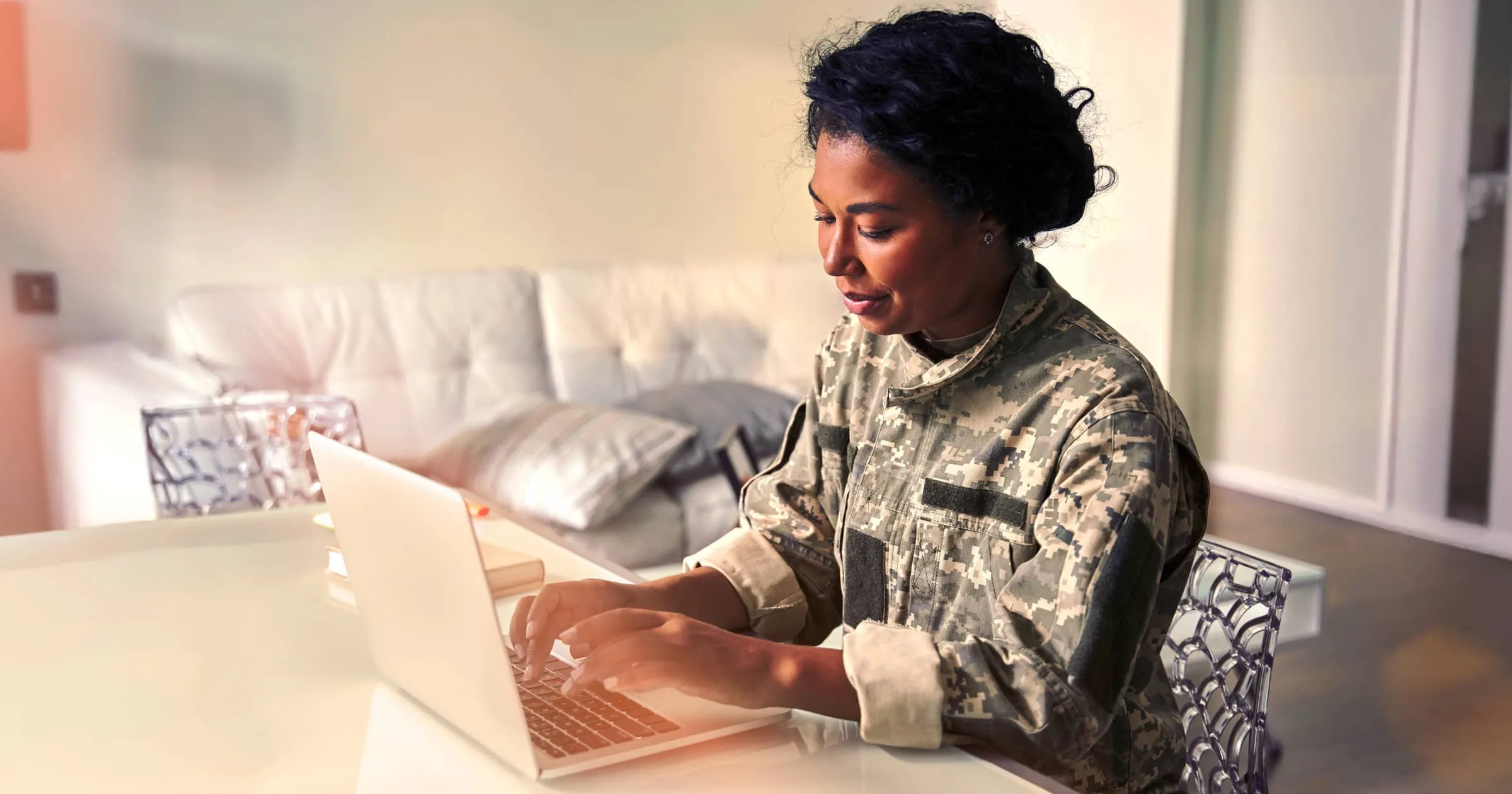 Woman typing on a laptop