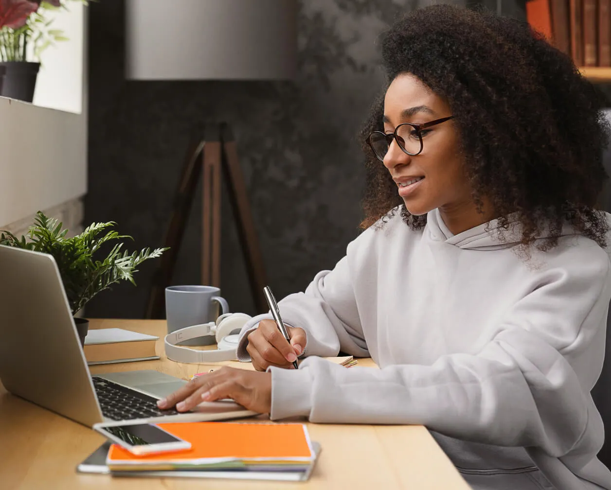 A student using RingCentral Video on her laptop to attend her online class