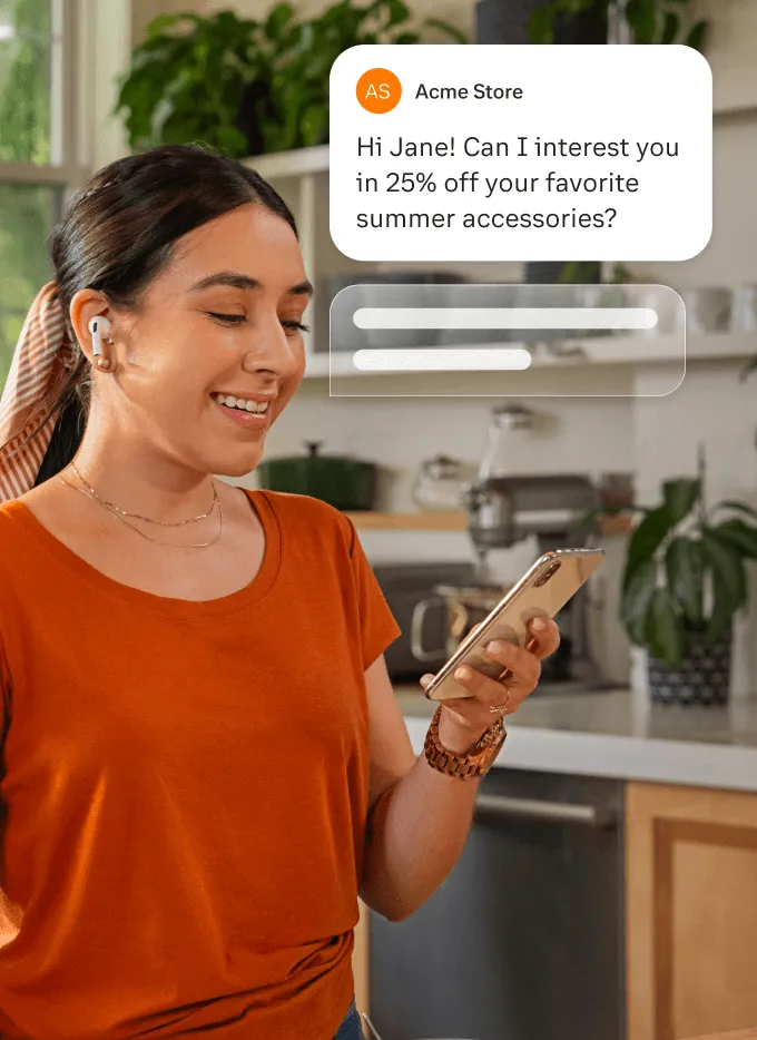 A woman reading an SMS messge sent via the RingCentral mobile app